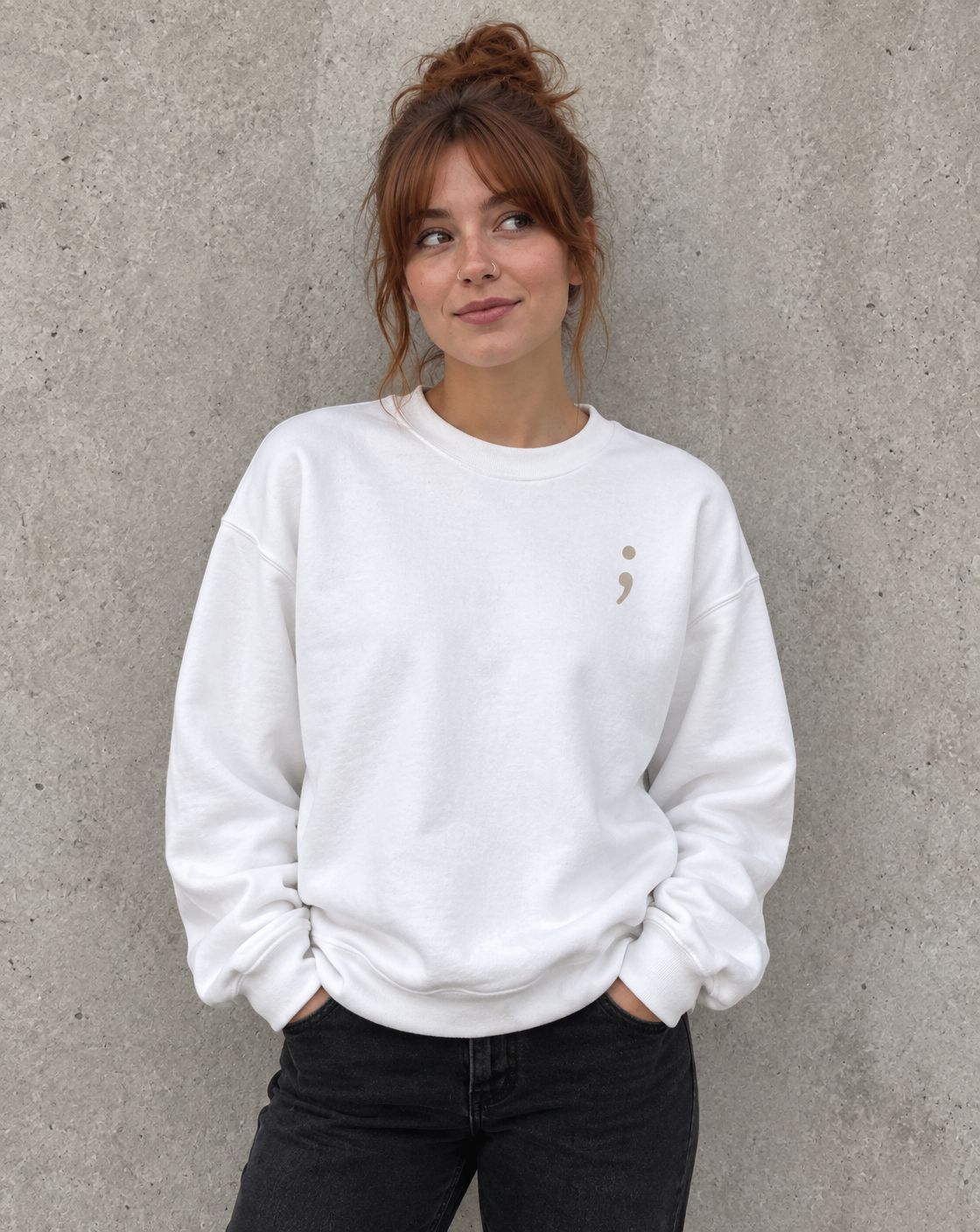 Model wearing the white You Belong Here crewneck sweatshirt, front view with small semicolon