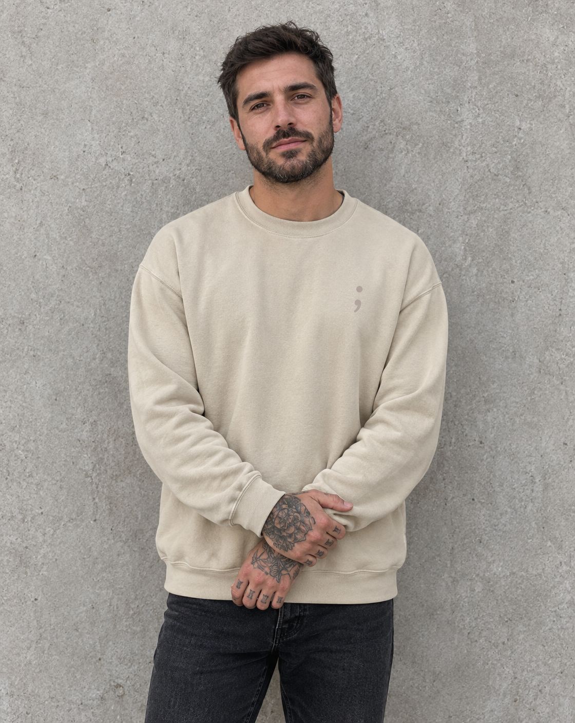 Model wearing the sand You Are More Than Your Hardest Day crewneck sweatshirt, front view with small semicolon