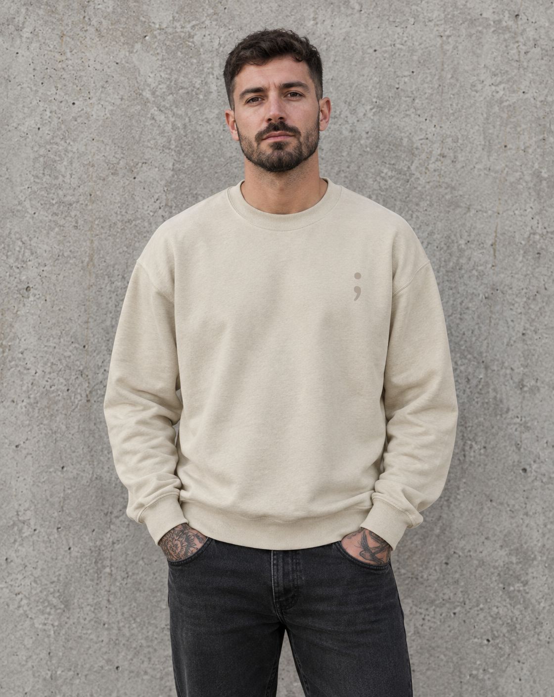 Model wearing the sand I Got Your Six crewneck sweatshirt, front view with small semicolon