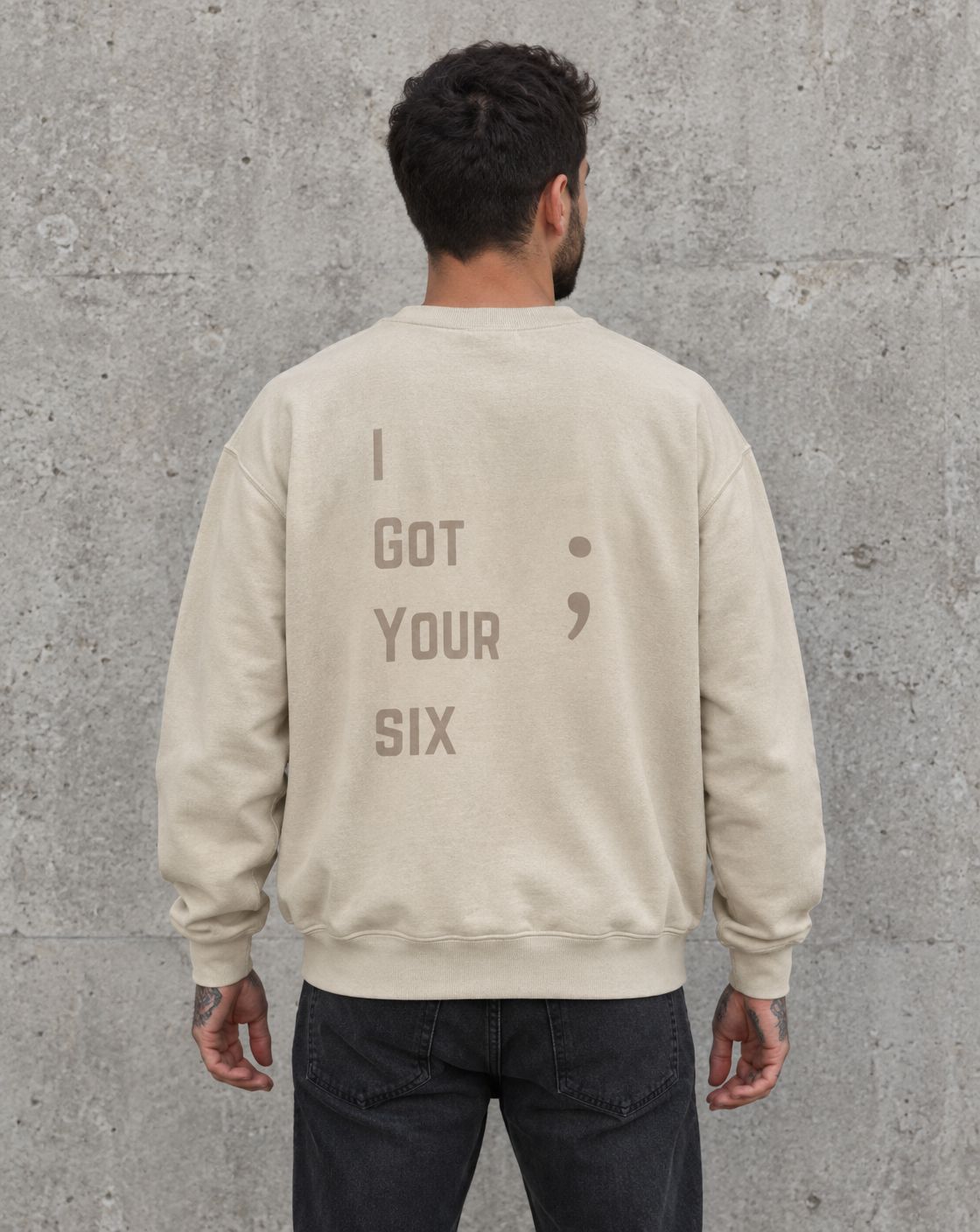 Model wearing the sand I Got Your Six veteran suicide awareness crewneck sweatshirt, back view