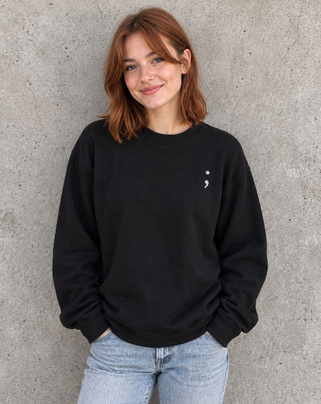 Model wearing the black You Matter. crewneck sweatshirt, front view with small semicolon