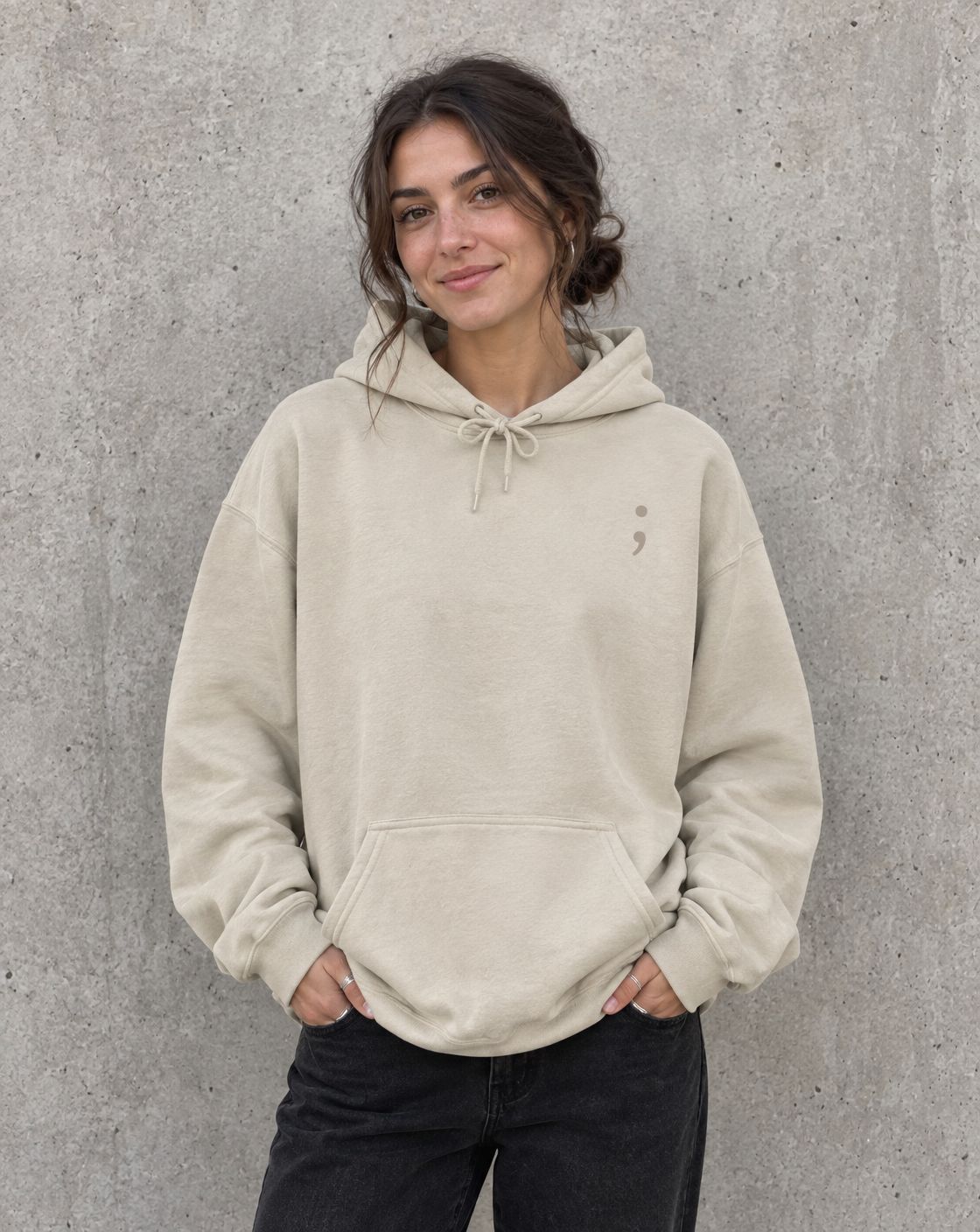 Model wearing the sand You Are More Than Your Hardest Day pullover hoodie, front view with small semicolon