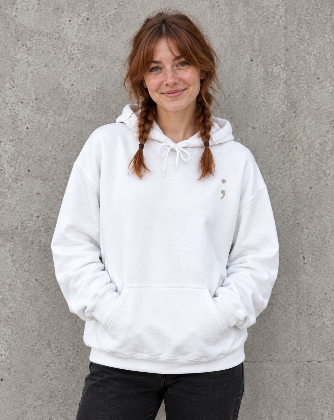 Model wearing the white I'm So Glad You're Here pullover hoodie, front view with small semicolon