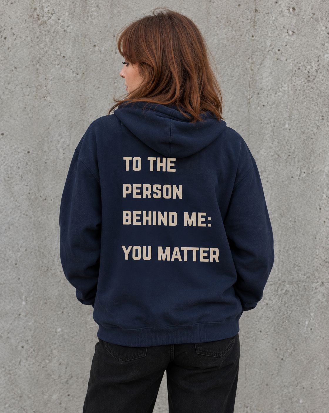Model wearing the navy To the Person Behind Me, You Matter suicide awareness zip up hoodie, back view