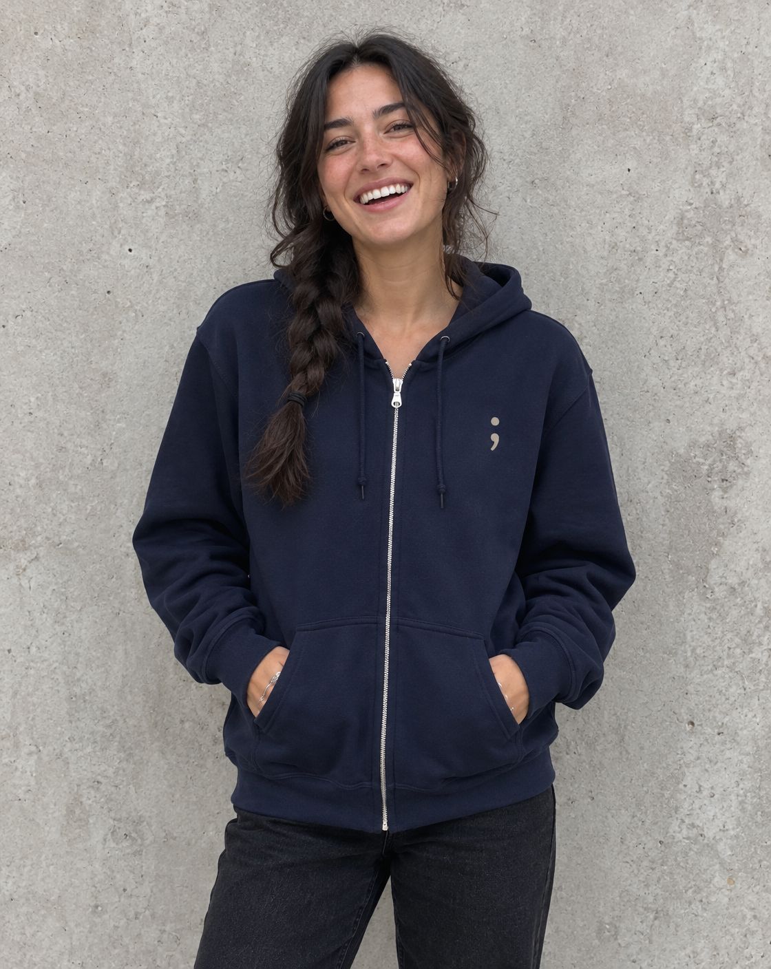 Model wearing the navy You Matter. zip up hoodie, front view with small semicolon