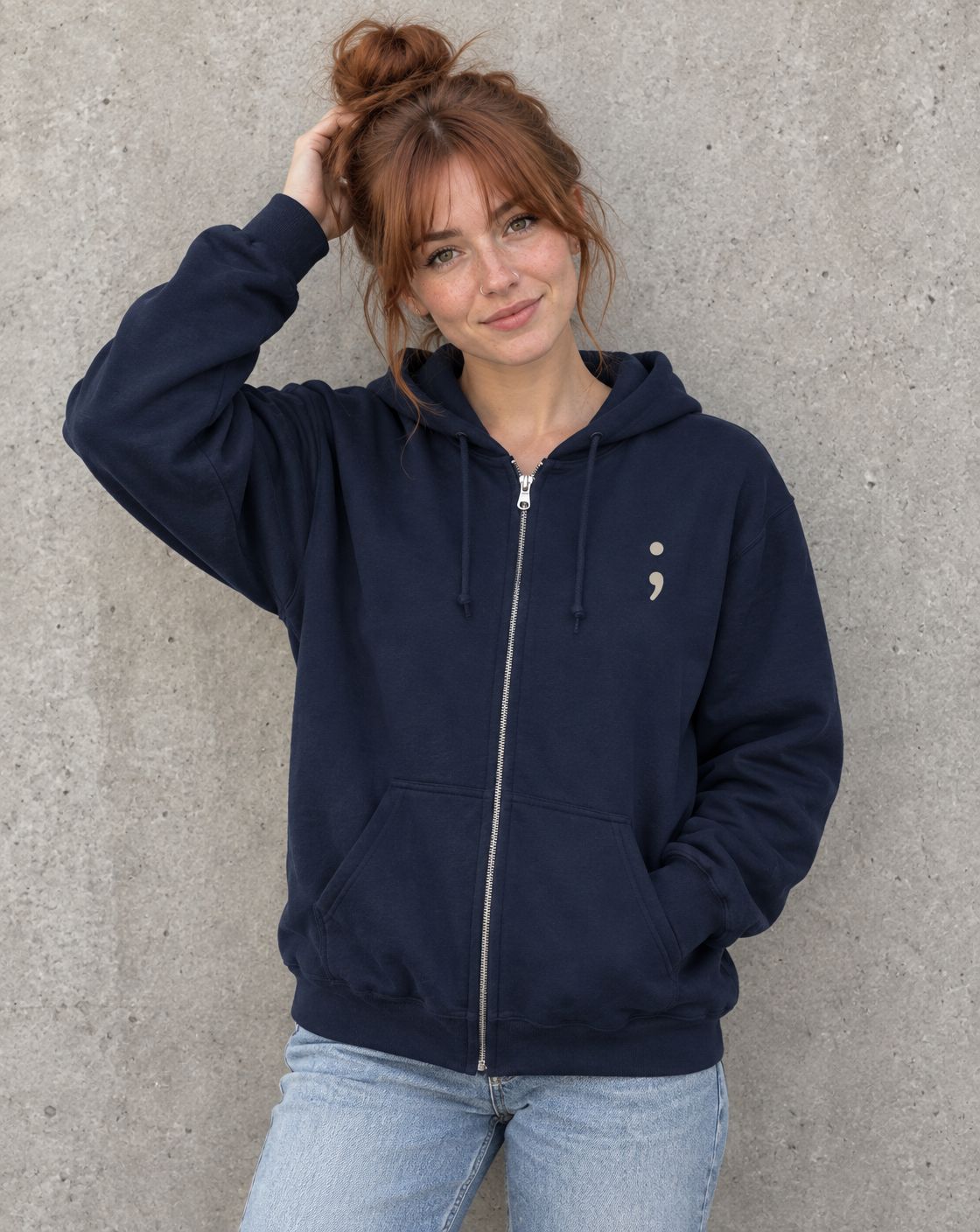 Model wearing the navy Stay for Tomorrow zip up hoodie, front view with small semicolon