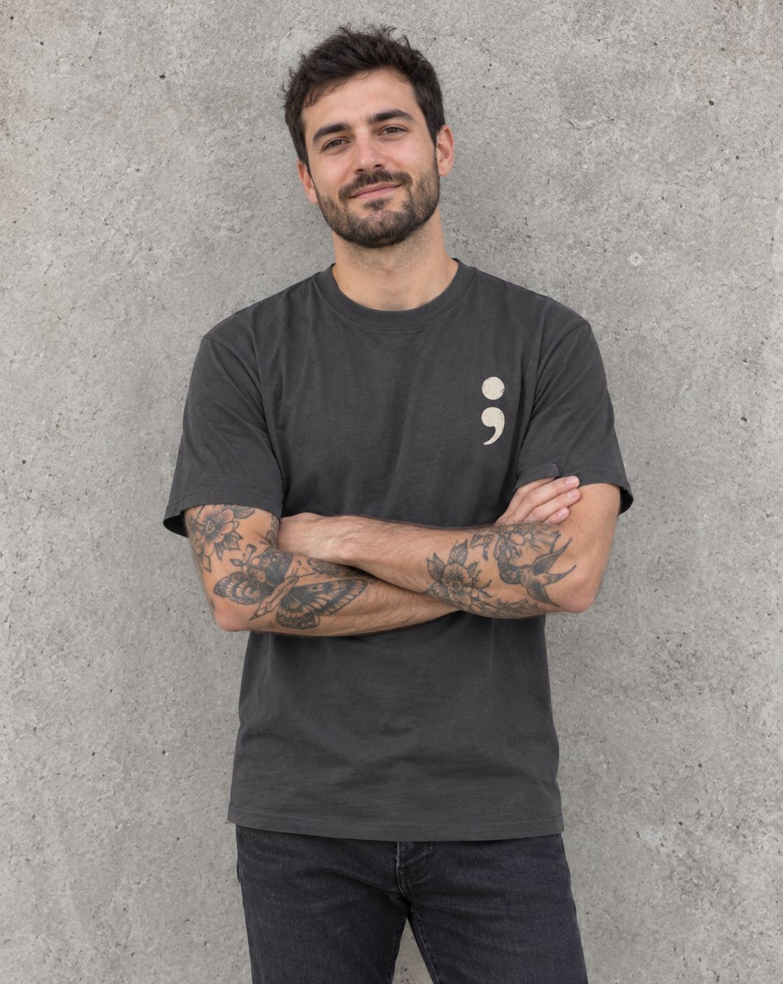 Model wearing the minimalist semicolon suicide awareness t-shirt with small chest semicolon
