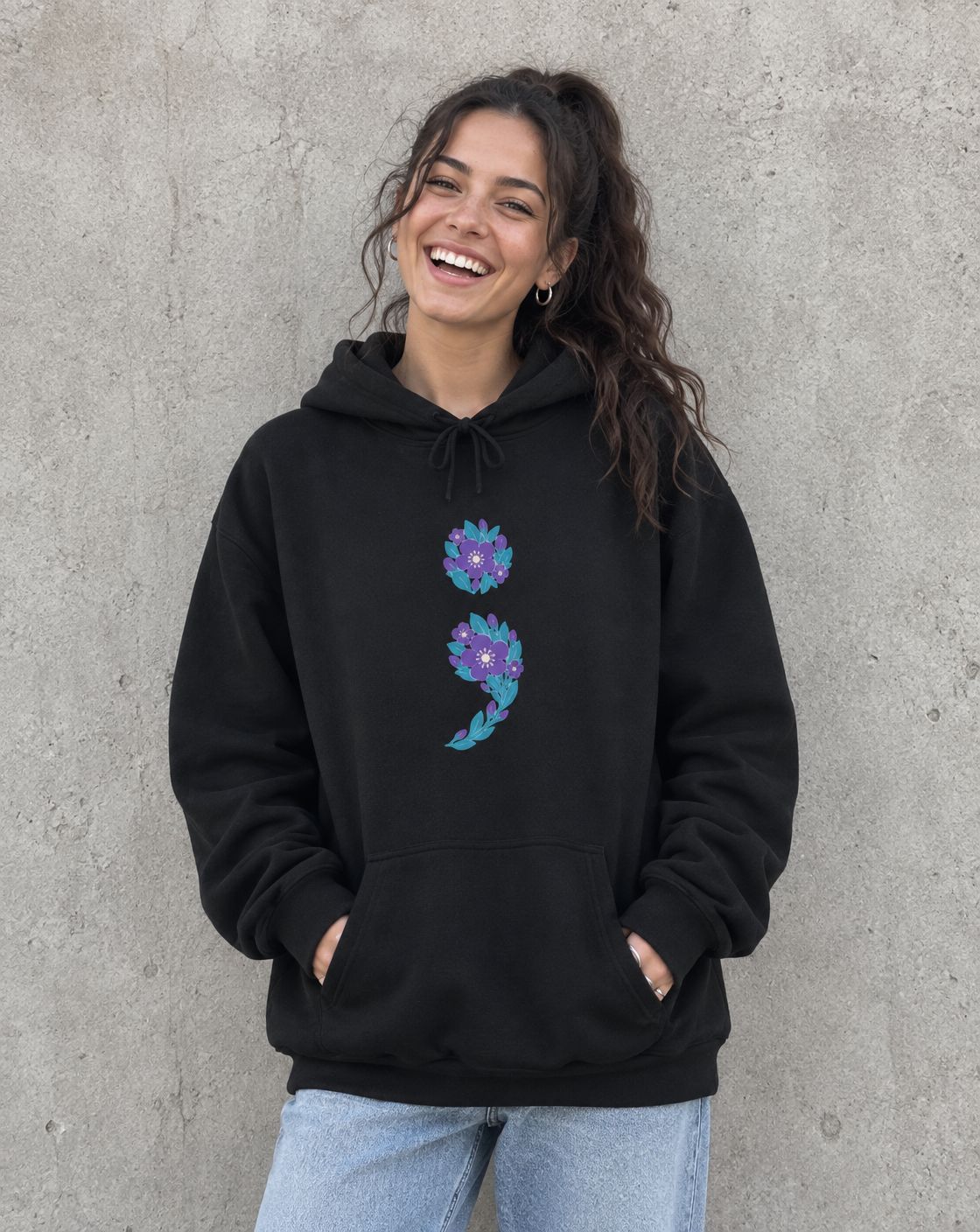 Model wearing the black floral semicolon pullover hoodie, front view