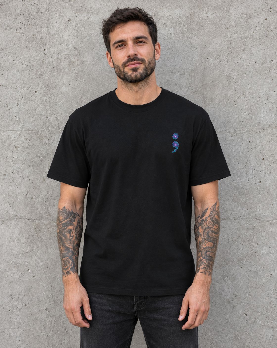 Model wearing the black purple and teal flag semicolon t-shirt, front view