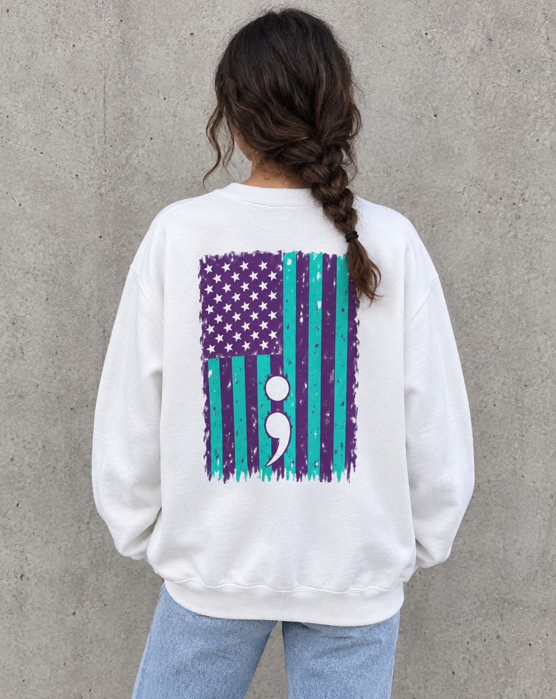 Model wearing the white purple and teal flag semicolon suicide awareness crewneck sweatshirt, back view