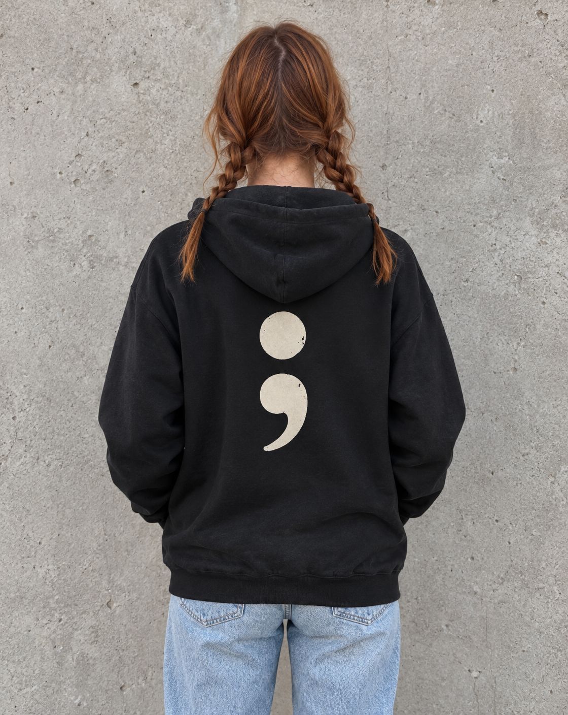 Model wearing the black oversized semicolon suicide awareness zip up hoodie, back view