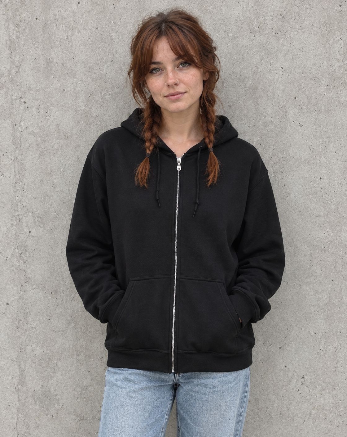 Model wearing the black oversized semicolon zip up hoodie, front view