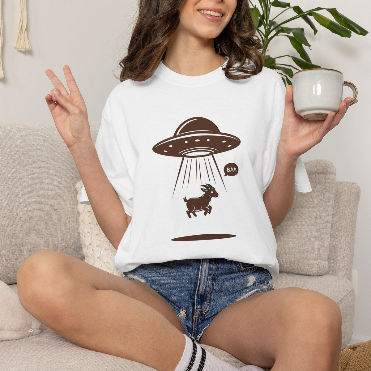 Wicked Thread Society white heavyweight cotton t-shirt featuring a playful UFO goat abduction graphic print.