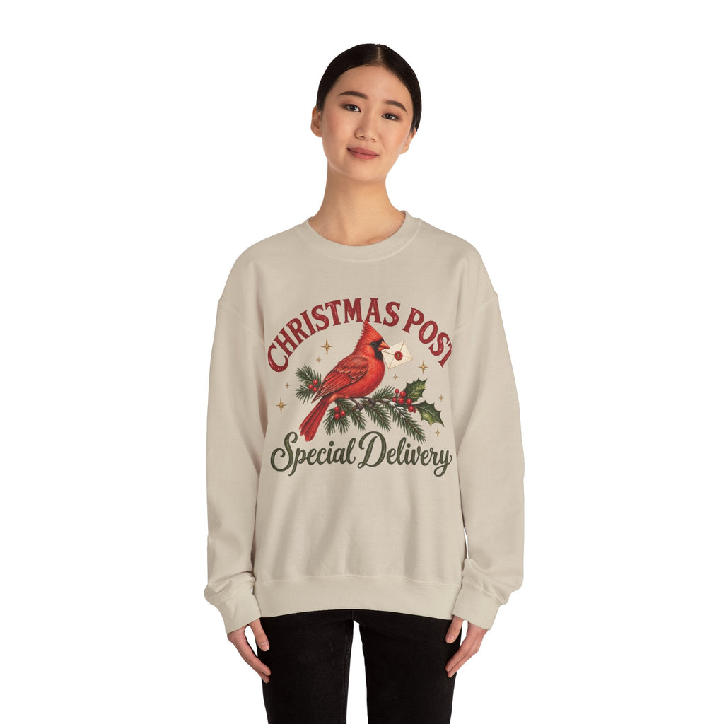 Wicked Thread Society beige crewneck sweatshirt featuring a red cardinal bird illustration and Christmas Post text.