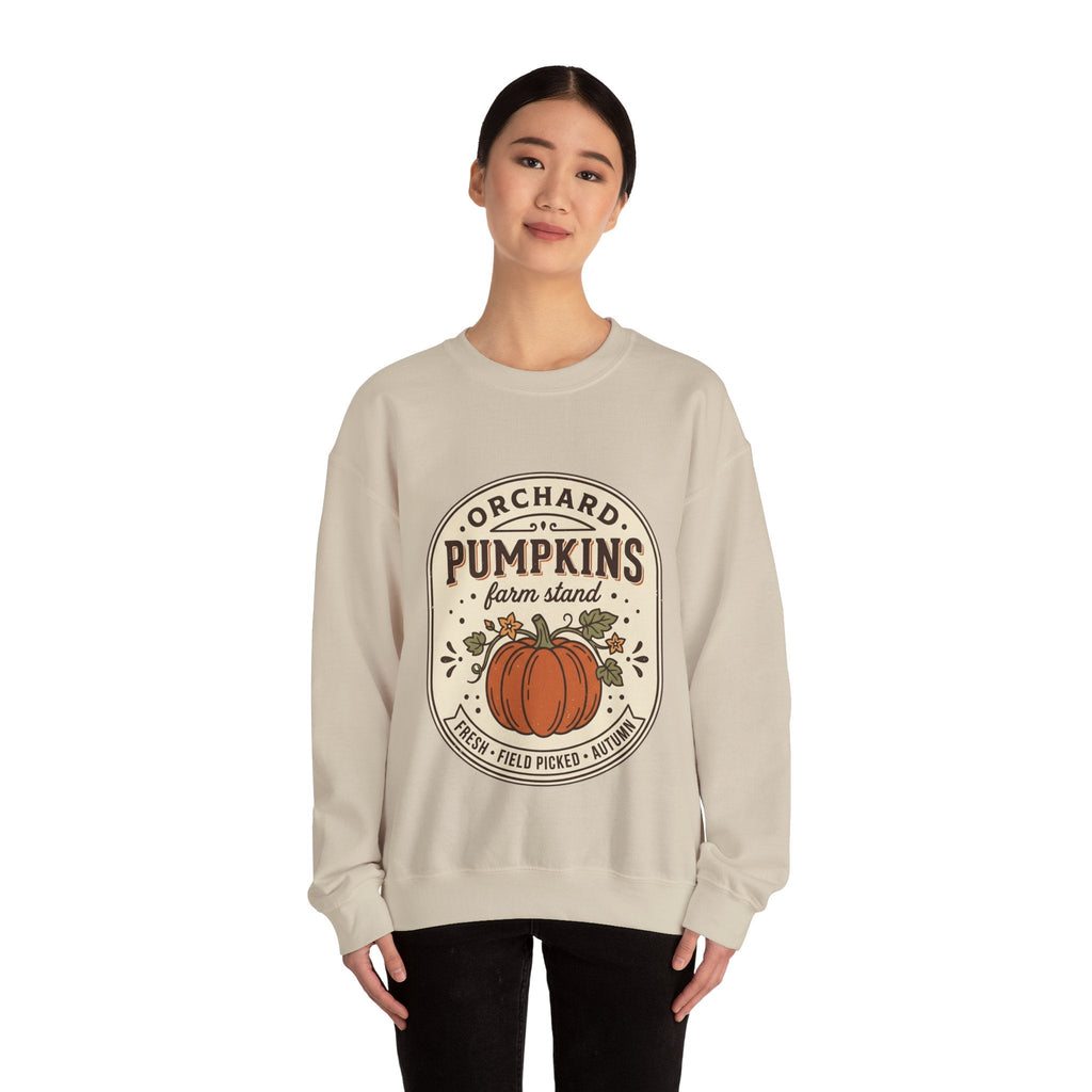 Wicked Thread Society beige crewneck sweatshirt with a vintage pumpkin farmstand graphic worn by a woman.