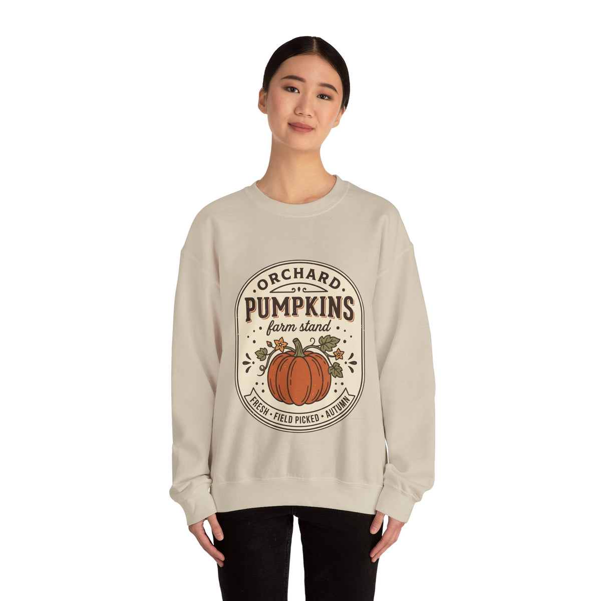 Wicked Thread Society beige crewneck sweatshirt with a vintage pumpkin farmstand graphic worn by a woman.