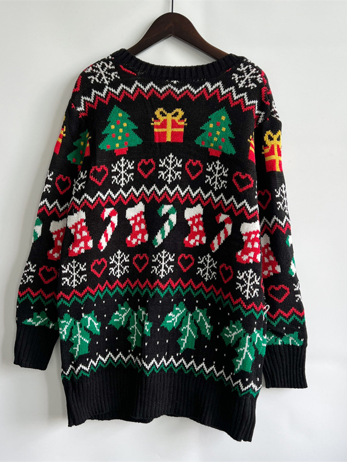 Wicked Thread Society black knit Christmas cardigan with festive holiday patterns including trees, gifts, and stockings