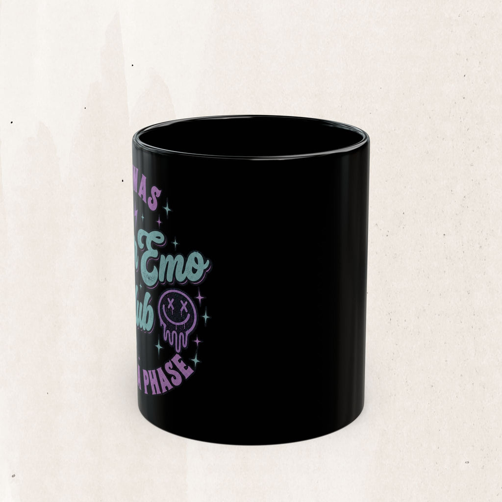 Wicked Thread Society black ceramic coffee mug featuring neon purple and blue Elder Emo Club graphic design.