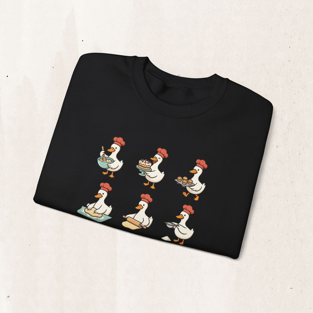 Wicked Thread Society black crewneck sweatshirt featuring a whimsical print of geese dressed as chefs baking.