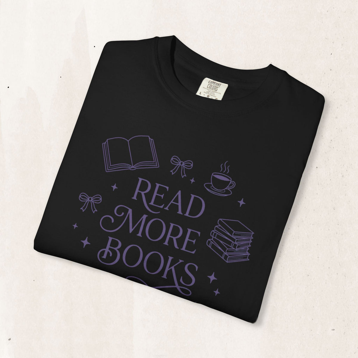 Wicked Thread Society black cotton graphic tee featuring a purple Read More Books illustration with a book and coffee