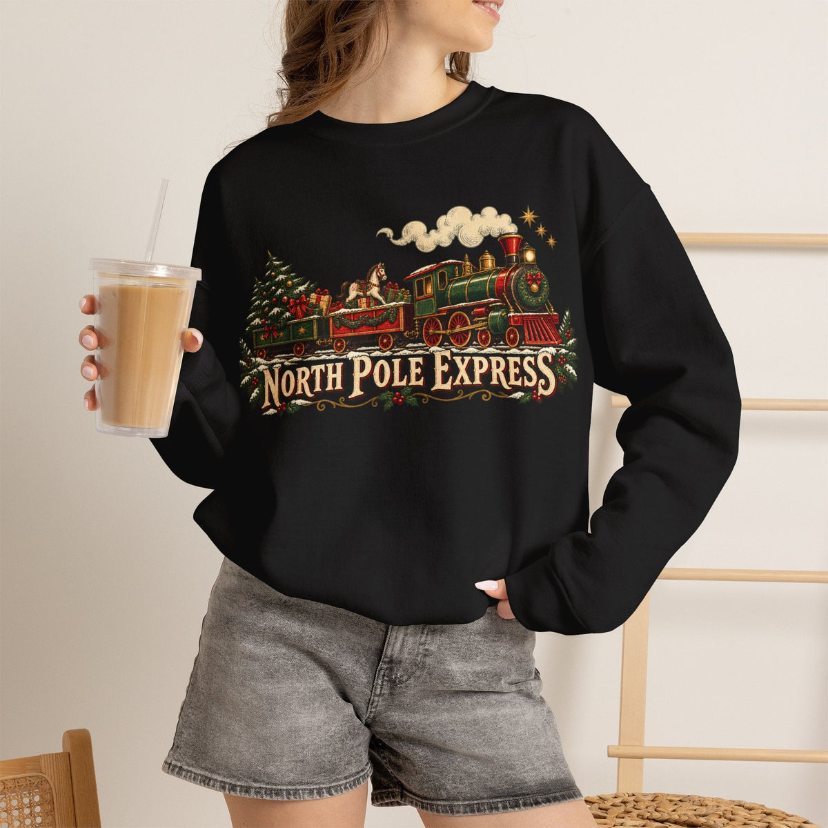 Wicked Thread Society black crewneck sweatshirt featuring a vintage North Pole Express steam train holiday graphic.