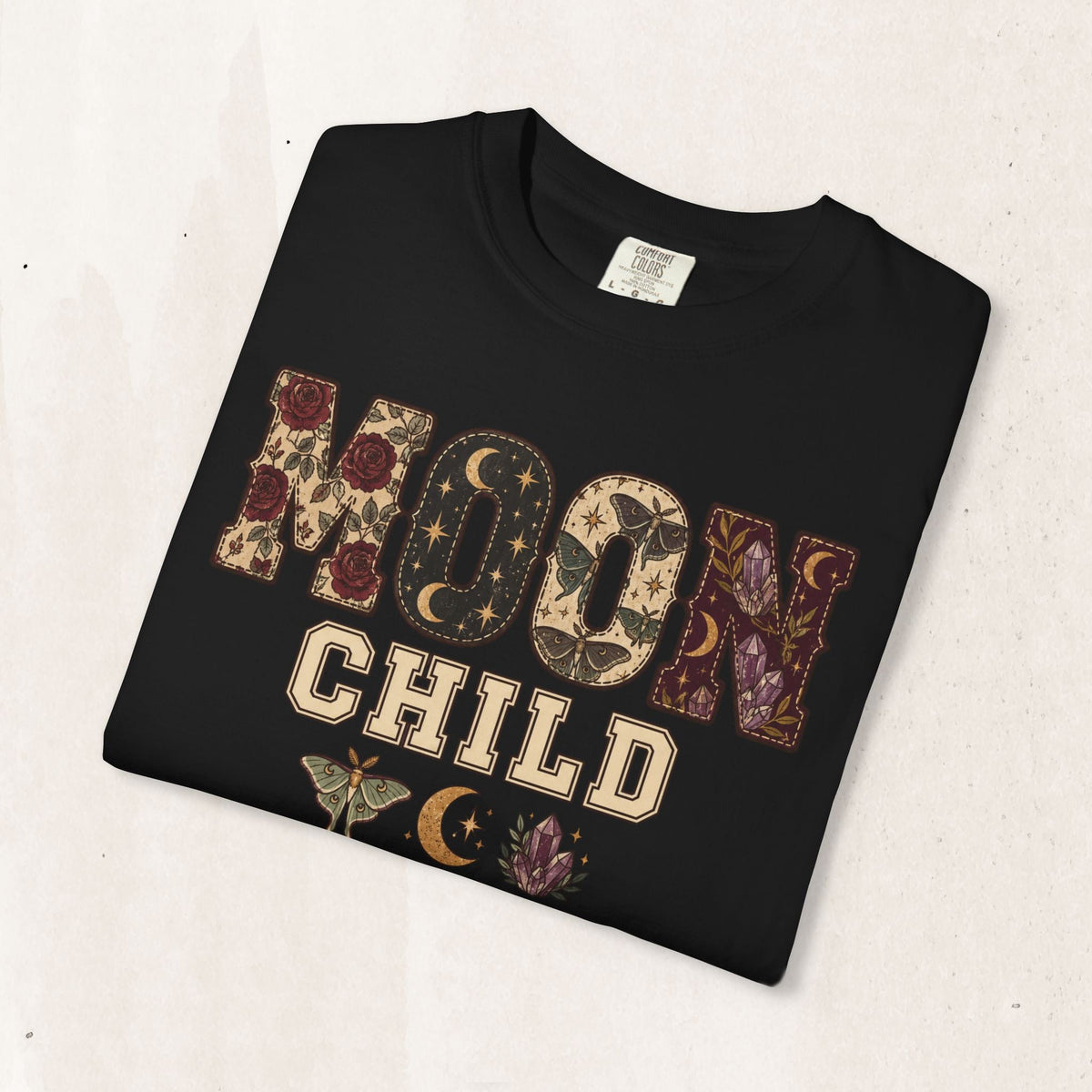Wicked Thread Society black heavyweight cotton graphic tee featuring Moon Child text with floral and celestial art.