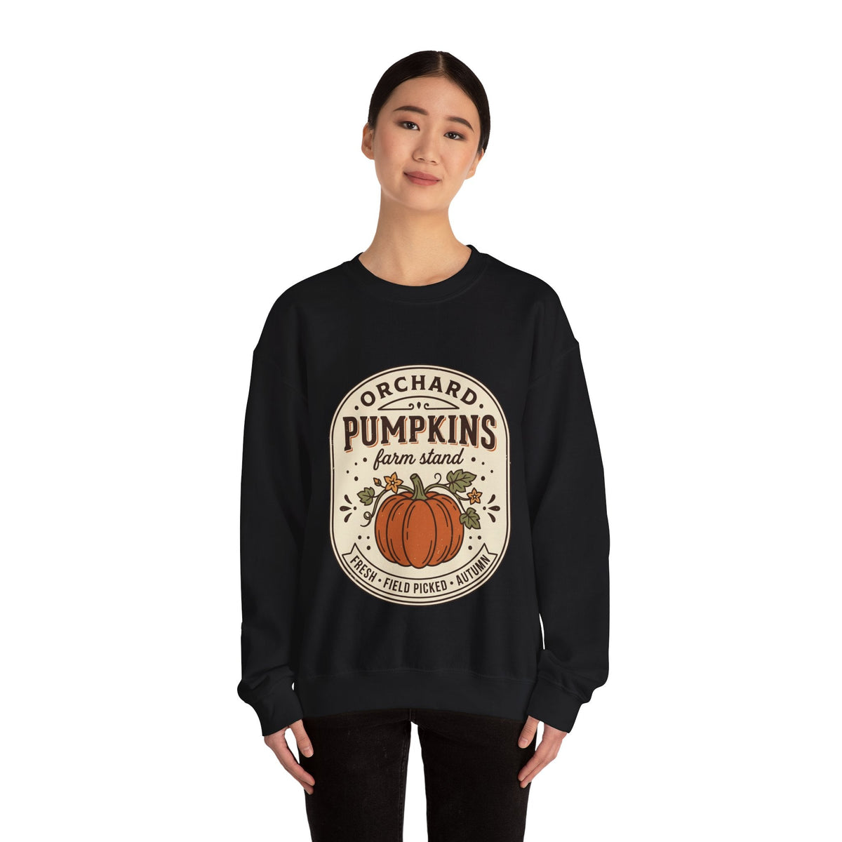 Wicked Thread Society black crewneck sweatshirt with a vintage pumpkin farmstand graphic print on a model