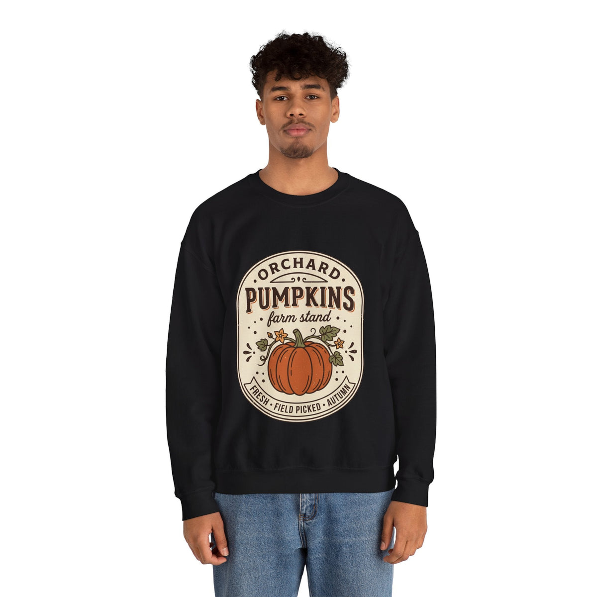 Wicked Thread Society black crewneck sweatshirt with a vintage pumpkin farmstand graphic worn by a young man