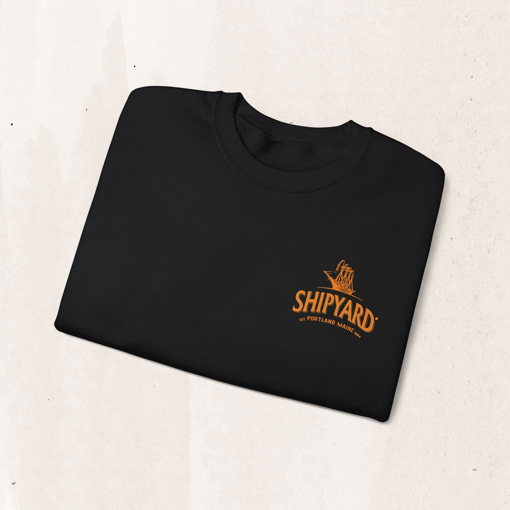 Wicked Thread Society black crewneck sweatshirt featuring a small orange embroidered Shipyard logo on the chest.