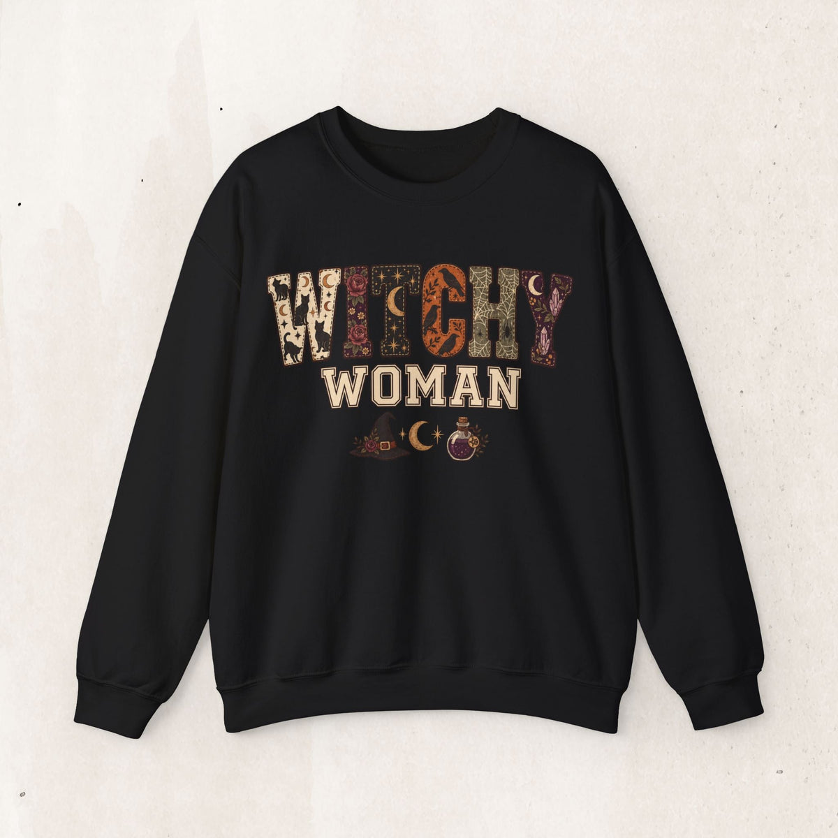 Wicked Thread Society black crewneck sweatshirt featuring a Witchy Woman graphic with moon, star, and potion motifs.
