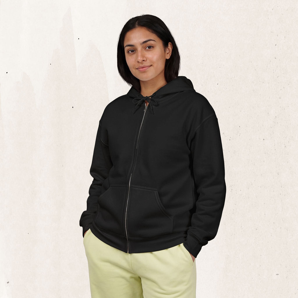 Wicked Thread Society black zip-up hoodie worn by a woman with light yellow sweatpants against a neutral background