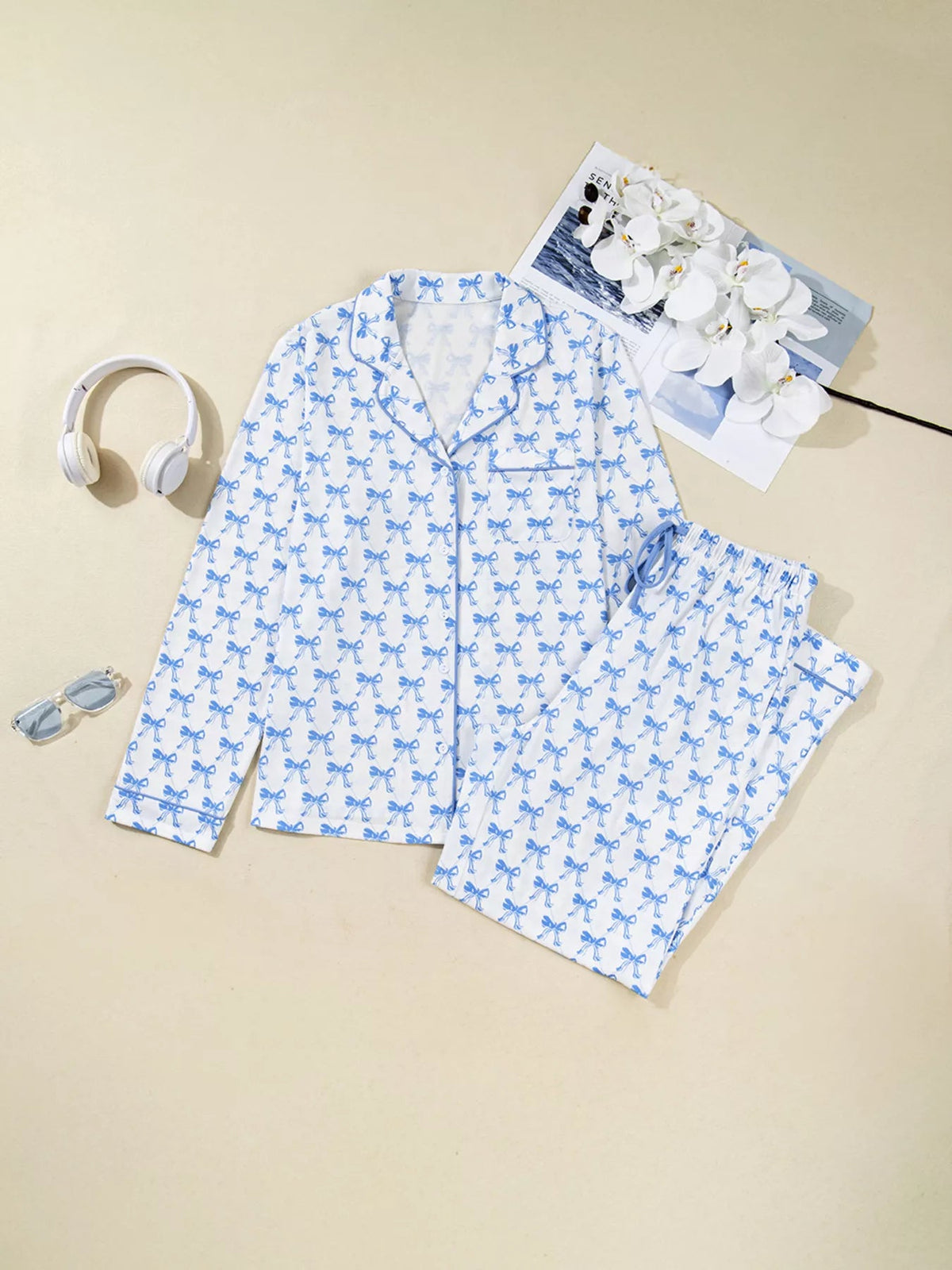 Wicked Thread Society two-piece pajama set with white and blue bow print, button-down shirt, and drawstring pants.