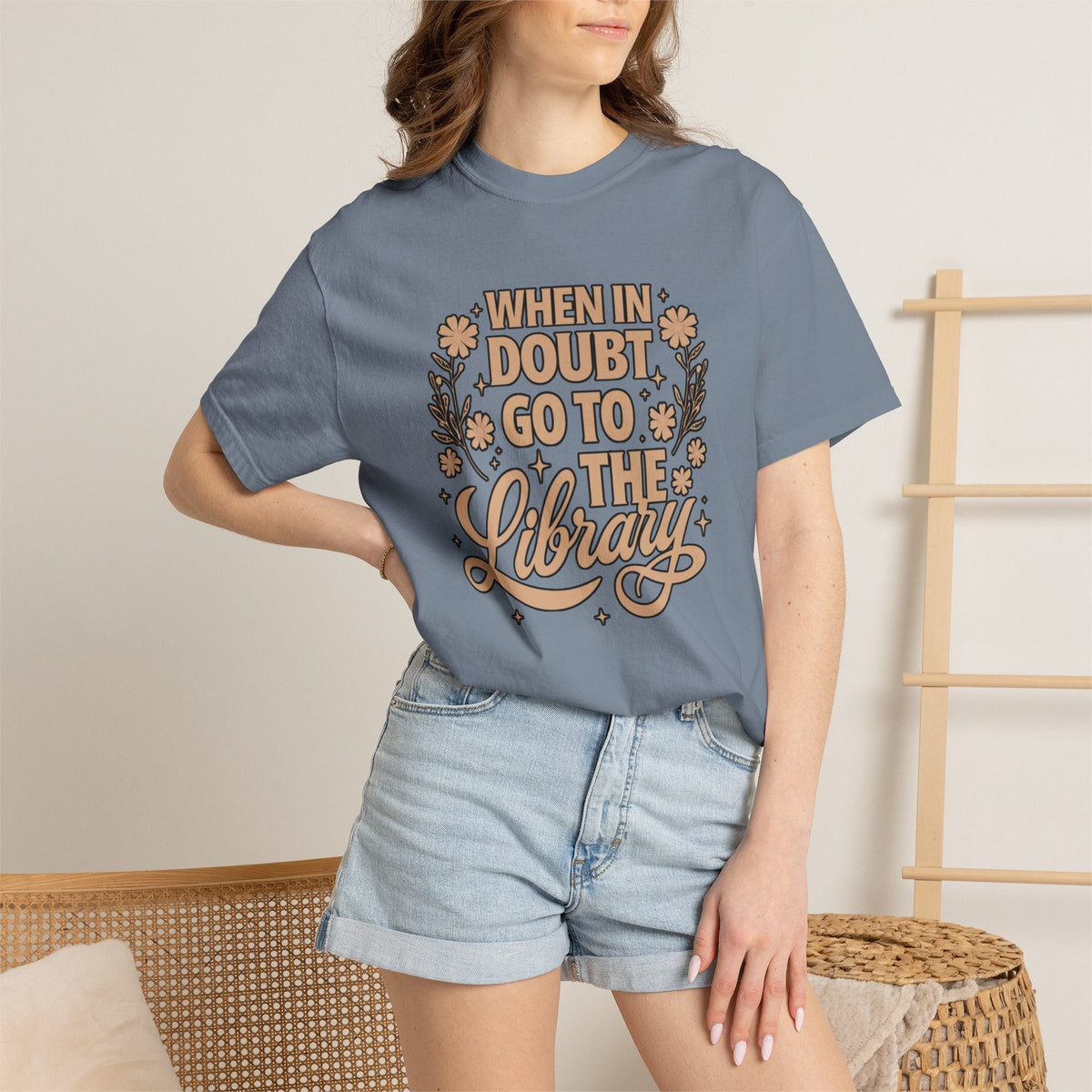 Wicked Thread Society blue garment-dyed cotton graphic tee with When in Doubt Go to the Library floral lettering.