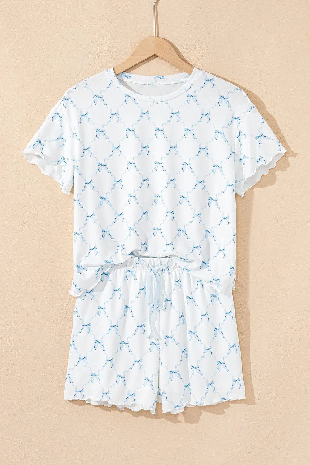 Wicked Thread Society two-piece lounge set with white and blue bow print, round neck top, and drawstring shorts.