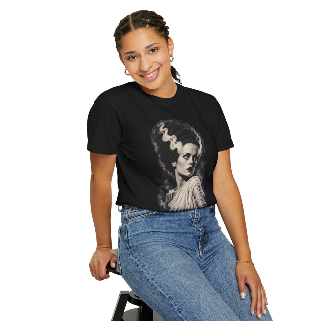 A woman wearing a black Wicked Thread Society crewneck t-shirt featuring a Bride of Frankenstein portrait graphic.
