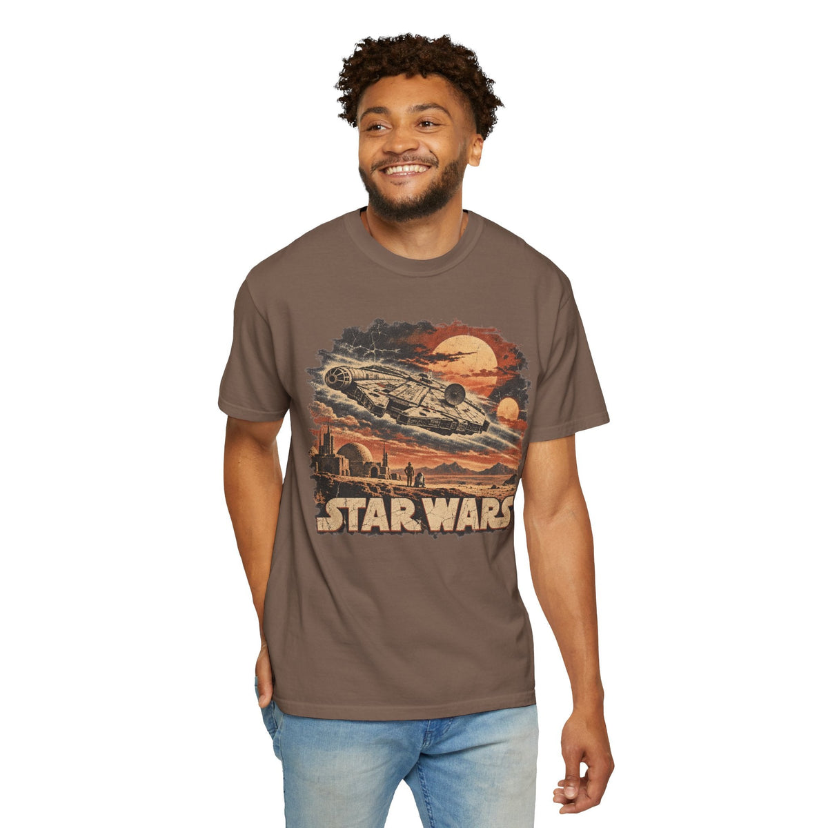 Wicked Thread Society brown Star Wars Millennium Falcon graphic t-shirt worn by a smiling man with jeans