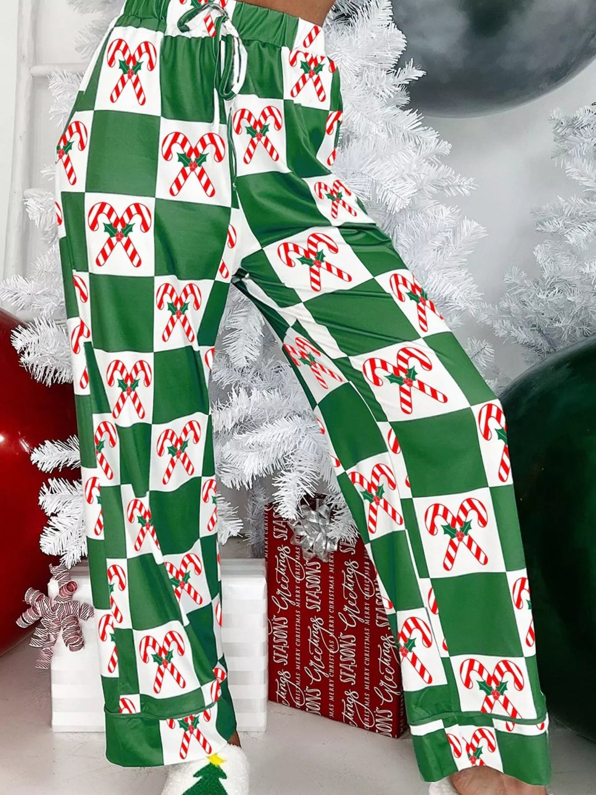 Wicked Thread Society pajama pants featuring a green and white checkered pattern with festive candy cane prints