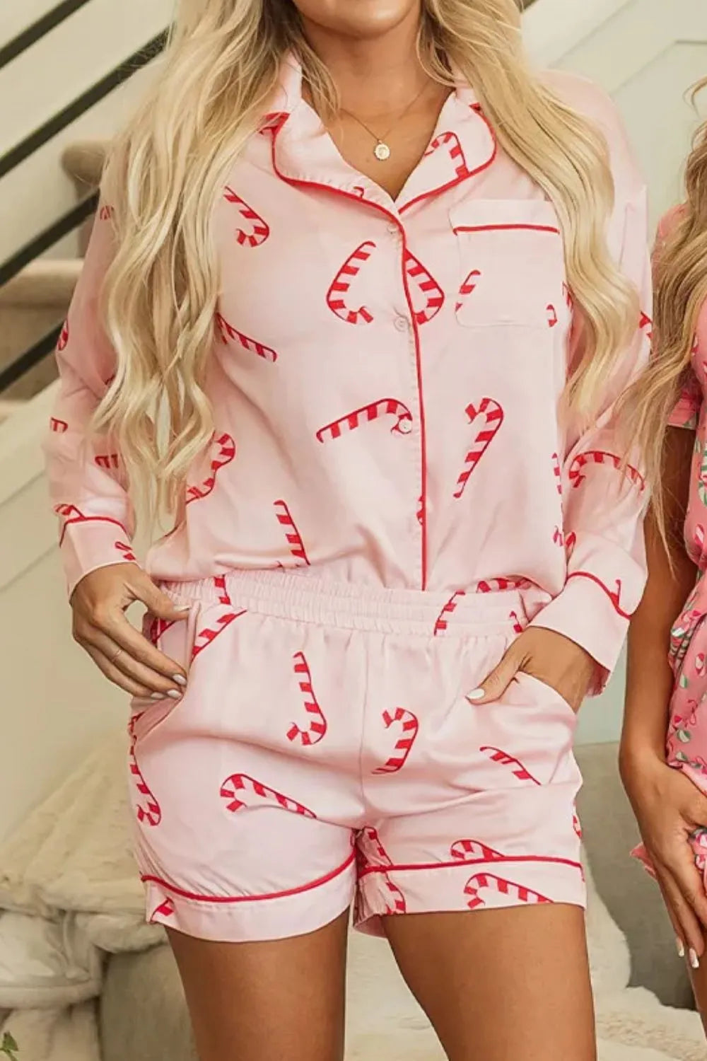 Wicked Thread Society pink lounge set with candy cane print, featuring a collared long sleeve top and matching shorts.