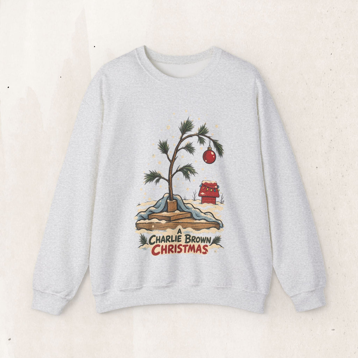 Wicked Thread Society grey crewneck sweatshirt featuring a nostalgic hand-illustrated Charlie Brown Christmas tree.