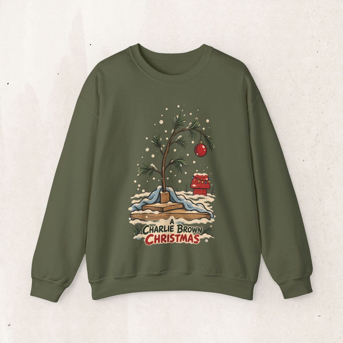 Wicked Thread Society olive green crewneck sweatshirt featuring a hand-illustrated Charlie Brown Christmas tree design.