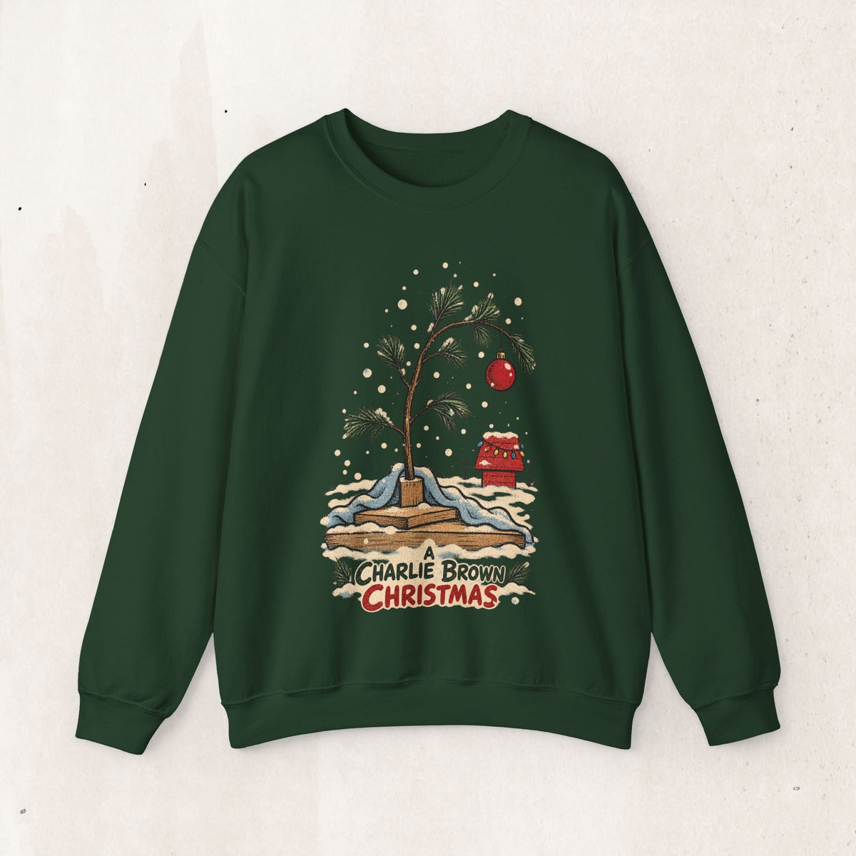 Wicked Thread Society dark green crewneck sweatshirt featuring a nostalgic Charlie Brown Christmas tree illustration.