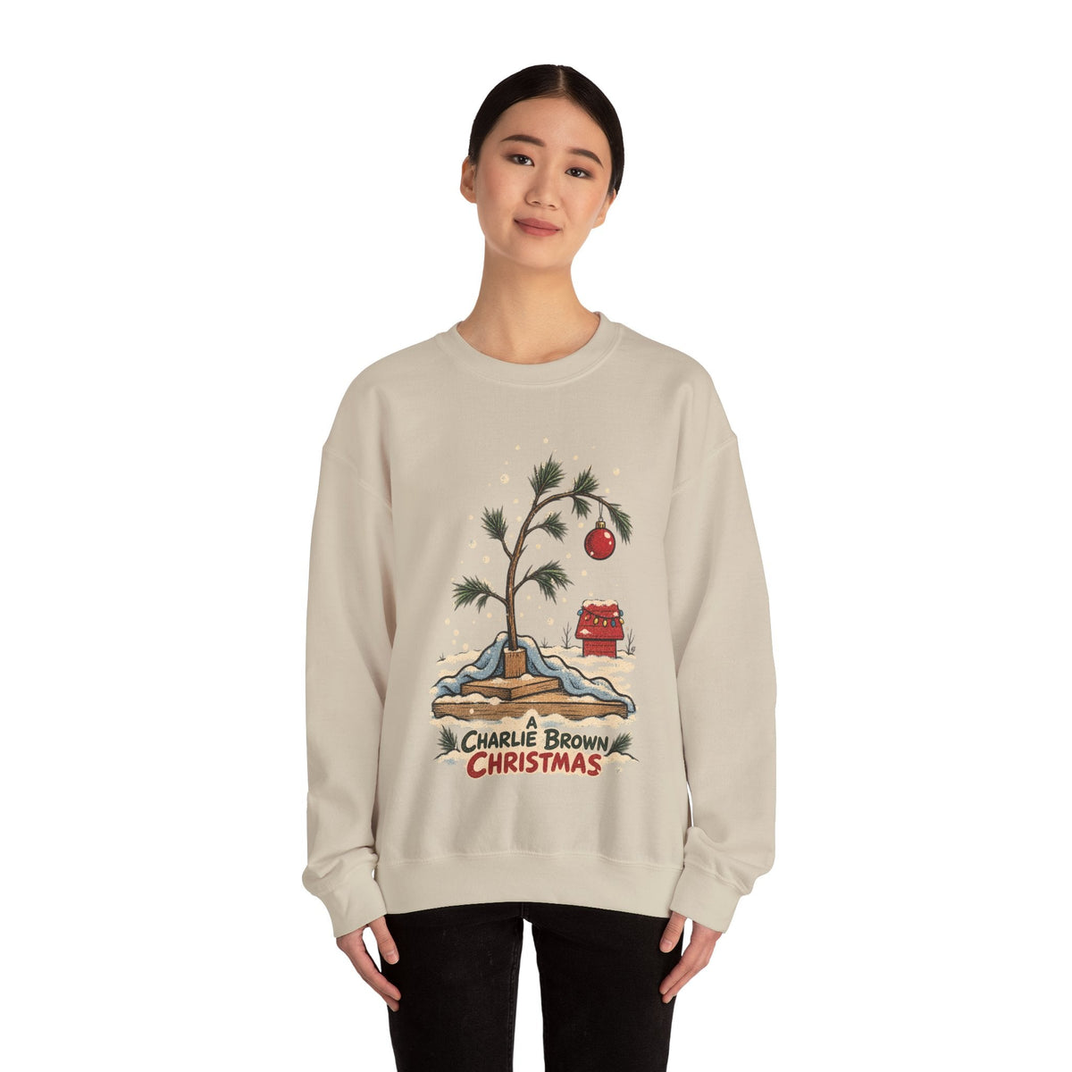 Wicked Thread Society beige crewneck sweatshirt featuring a hand-illustrated Charlie Brown Christmas tree graphic.