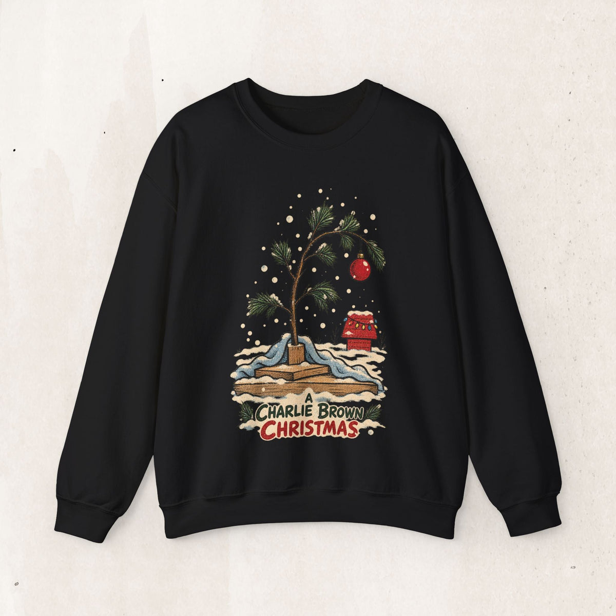 Wicked Thread Society black crewneck sweatshirt featuring a hand-illustrated Charlie Brown Christmas tree graphic.
