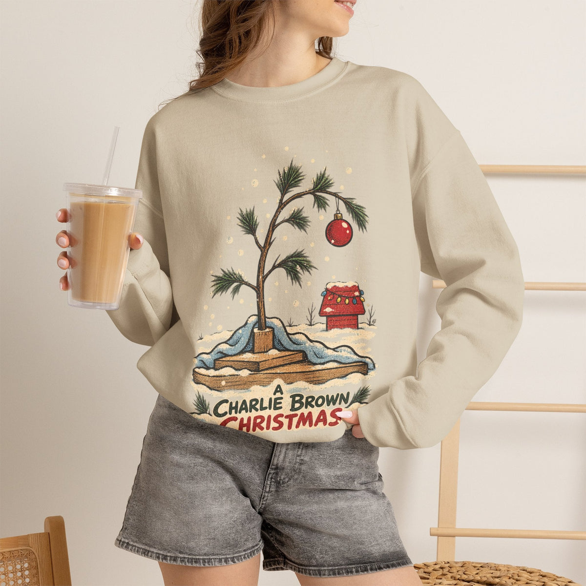 Wicked Thread Society beige crewneck sweatshirt featuring a hand-illustrated Charlie Brown Christmas tree graphic.