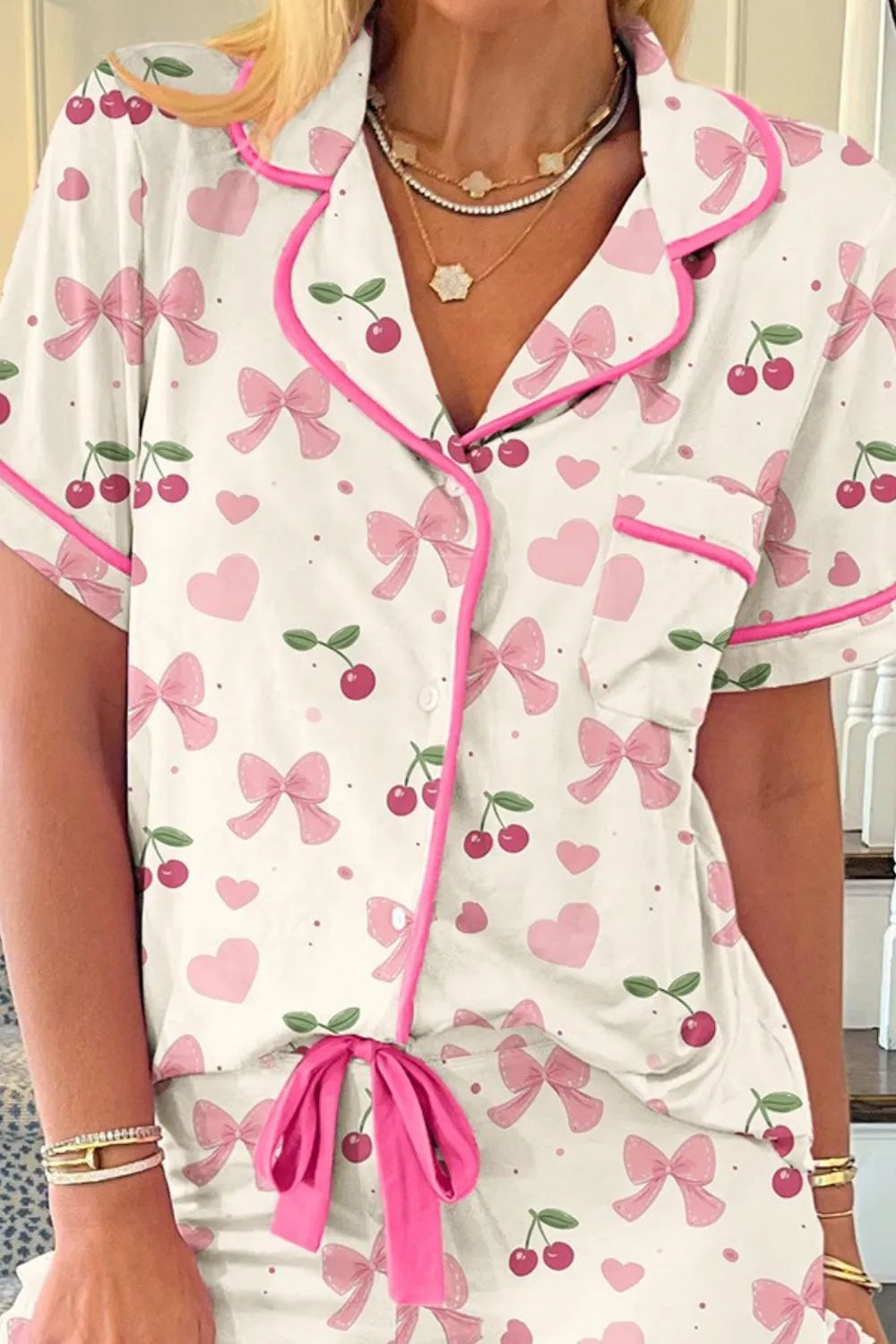 Wicked Thread Society two-piece lounge set with white cherry, heart, and bow print, featuring pink piping and trim.