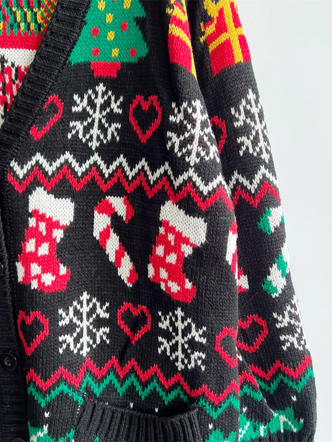 Wicked Thread Society black knit cardigan with festive Christmas pattern including candy canes, stockings, and hearts.