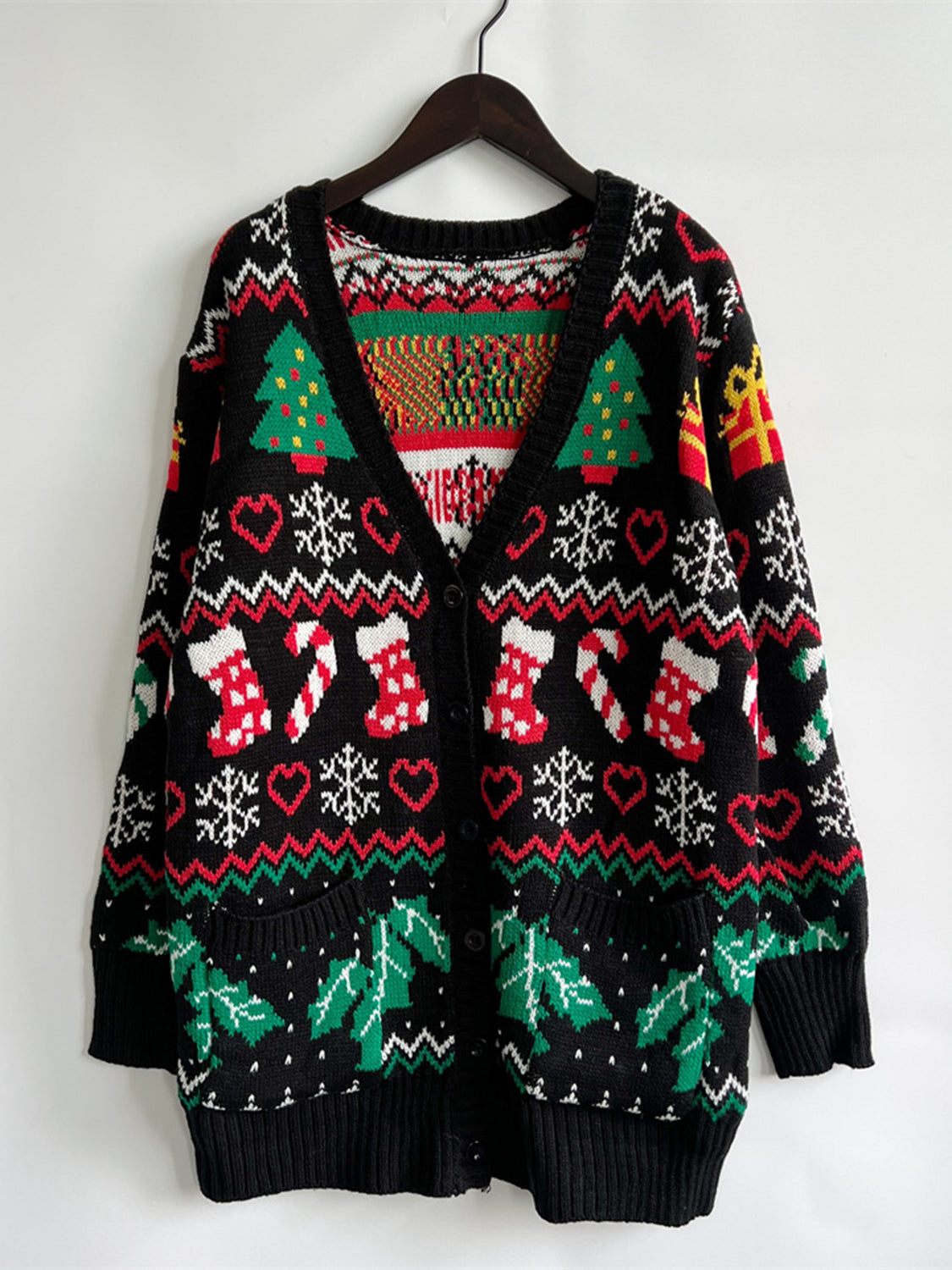 Wicked Thread Society black V-neck cardigan featuring festive Christmas trees, stockings, and snowflake patterns.