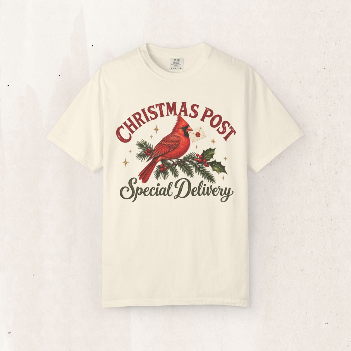 Wicked Thread Society cream graphic t-shirt featuring a red cardinal on a pine branch with Christmas Post text.