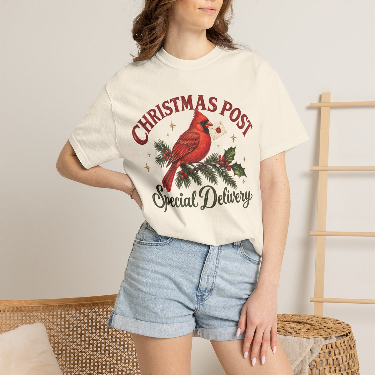Wicked Thread Society cream graphic t-shirt featuring a red cardinal on a pine branch with Christmas Post text.
