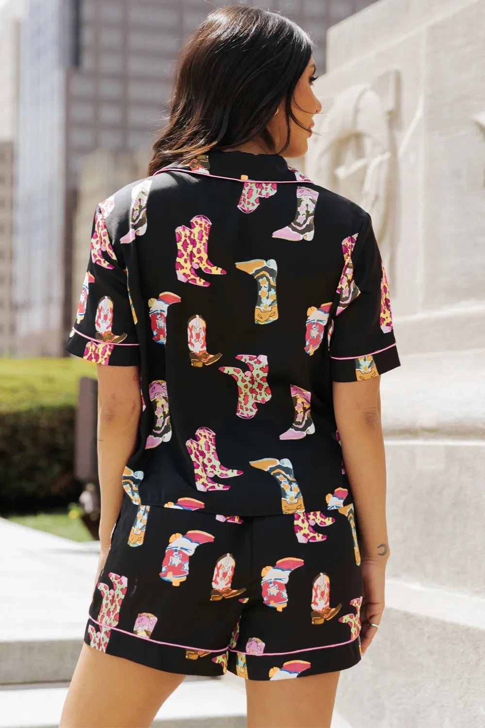 Wicked Thread Society black lounge set with colorful cowboy boot print, button-up top, and matching shorts.